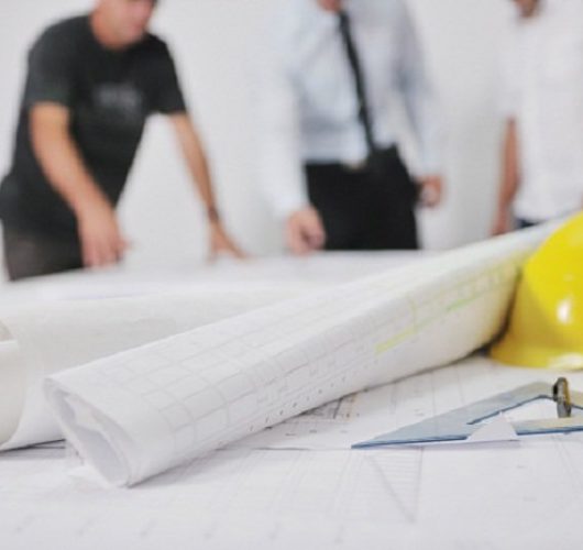 Team of architects people in group  on construciton site check documents and business workflow